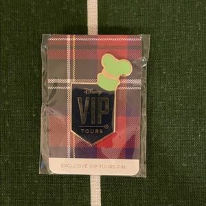Disney VIP Tours Pin with Green and Red Plaid
